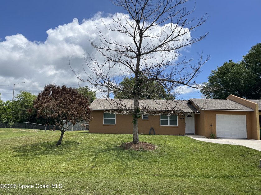 ADORABLE UPDATED 1/2 DUPLEX With a LARGE Fenced BACK YARD and a - Beach Home for sale in Merritt Island, Florida on Beachhouse.com
