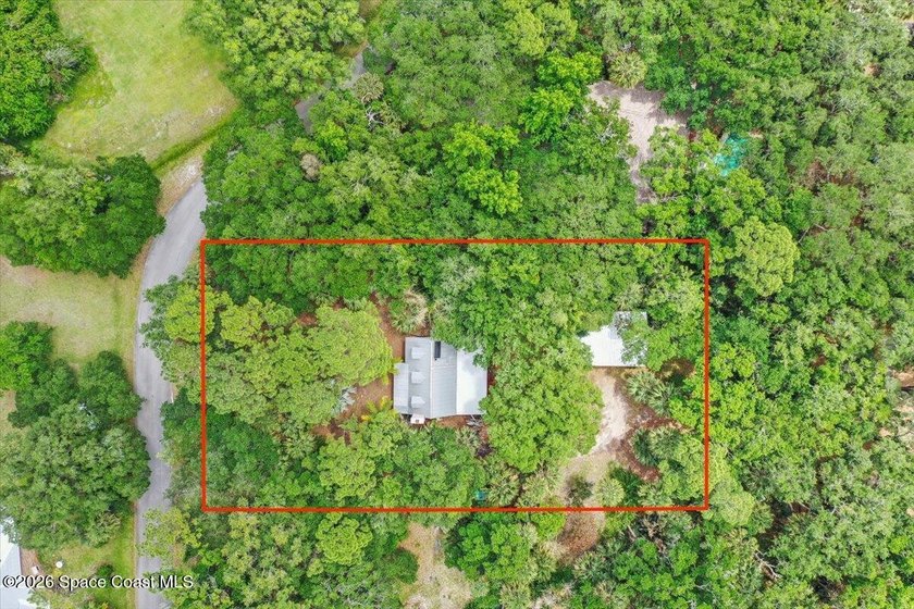 Tucked away on a lush, private one-acre homesite in the heart of - Beach Home for sale in Melbourne Village, Florida on Beachhouse.com