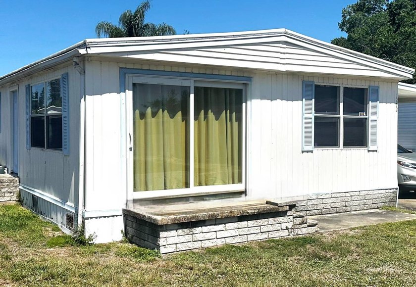 GREAT PRICE FOR A 3 BEDROOM 2 FULL BATH DOUBLWIDE in an all age - Beach Home for sale in Largo, Florida on Beachhouse.com