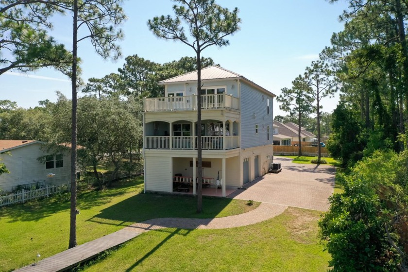 Welcome to your waterfront sanctuary at 95 Bluebell Cir, Santa - Beach Home for sale in Santa Rosa Beach, Florida on Beachhouse.com