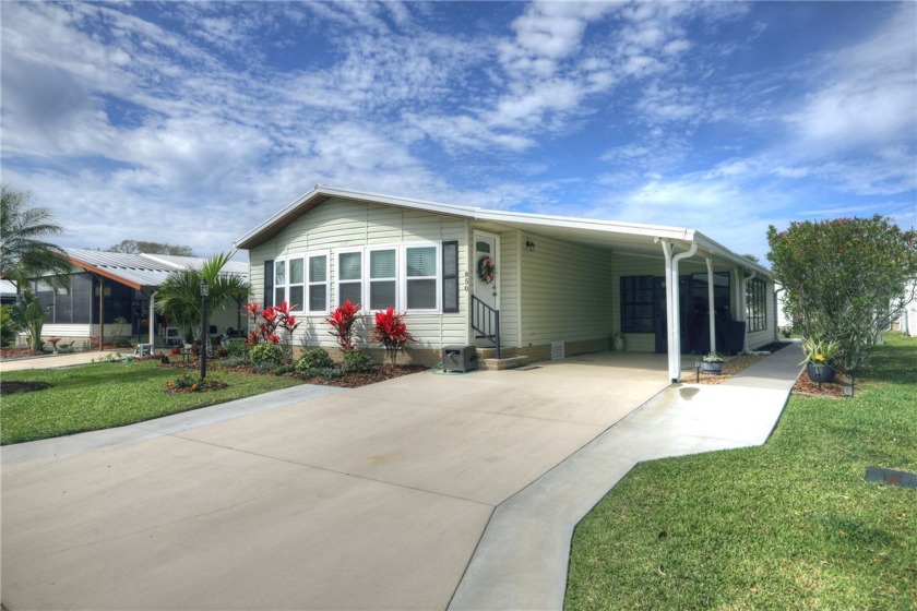 Tastefully remodeled with coastal charm. Step into this bright - Beach Home for sale in Barefoot Bay, Florida on Beachhouse.com