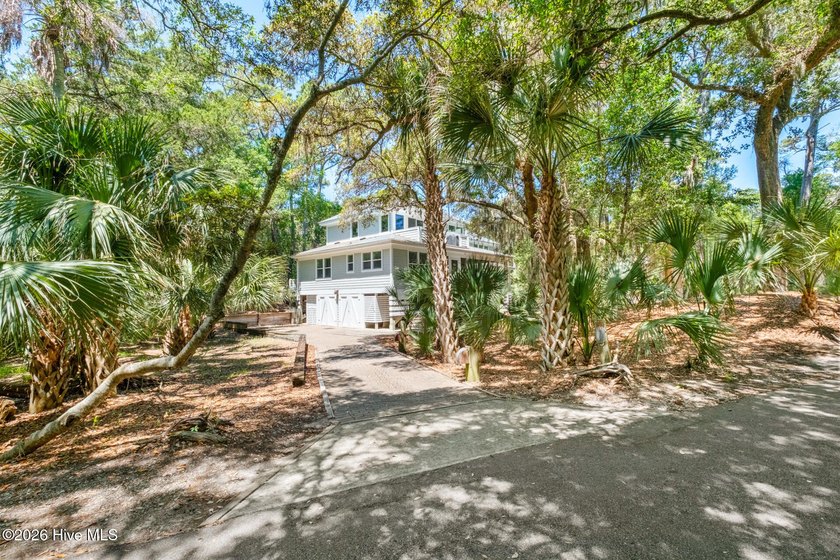 Located on a spacious lot shaded by stunning palm trees in the - Beach Home for sale in Bald Head Island, North Carolina on Beachhouse.com