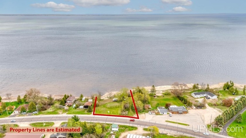 Enjoy the waves washing against the shoreline with a soft - Beach Lot for sale in Escanaba, Michigan on Beachhouse.com