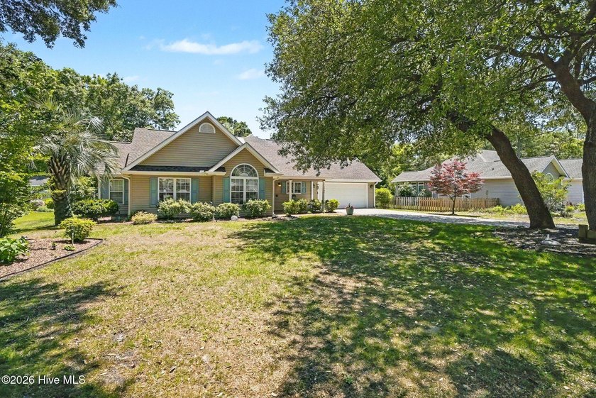 Welcome to Lake Tree Shores, where mature trees, spacious - Beach Home for sale in Ocean Isle Beach, North Carolina on Beachhouse.com
