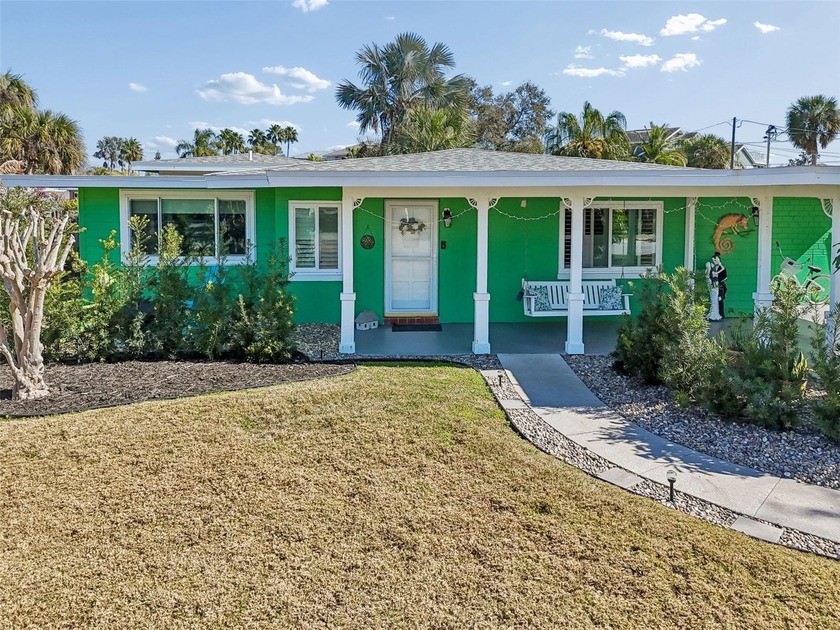 Just one block from the serene waters of the Gulf, this home has - Beach Home for sale in Dunedin, Florida on Beachhouse.com