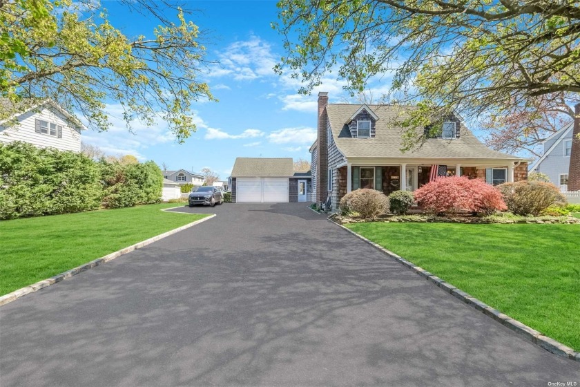 Welcome Home to this enchanting Colonial that is Nestled along - Beach Home for sale in Amityville, New York on Beachhouse.com