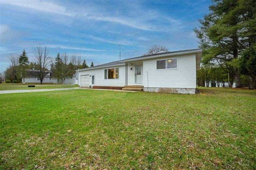 Welcome to this charming 2-bedroom, 1-bath ranch nestled on a - Beach Home for sale in Charlevoix, Michigan on Beachhouse.com