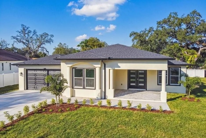 Welcome to this stunning newly built (2023) single-story luxury - Beach Home for sale in Tampa, Florida on Beachhouse.com