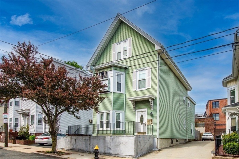 Welcome to this RARE beautifully Renovated 3-Family Home nestled - Beach Home for sale in Boston, Massachusetts on Beachhouse.com