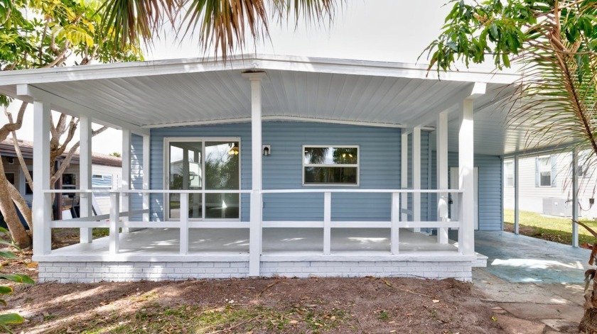From the moment you walk in the door, this home has the WOW - Beach Home for sale in Barefoot Bay, Florida on Beachhouse.com