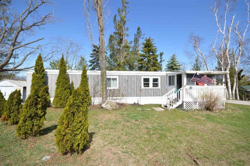 Affordable living in Northern Michigan! This well-maintained - Beach Home for sale in Charlevoix, Michigan on Beachhouse.com