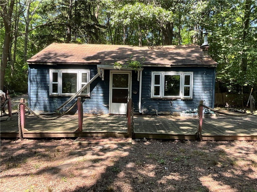 This cottage is in a very natural wooded setting along Marsh - Beach Home for sale in Carlton, New York on Beachhouse.com