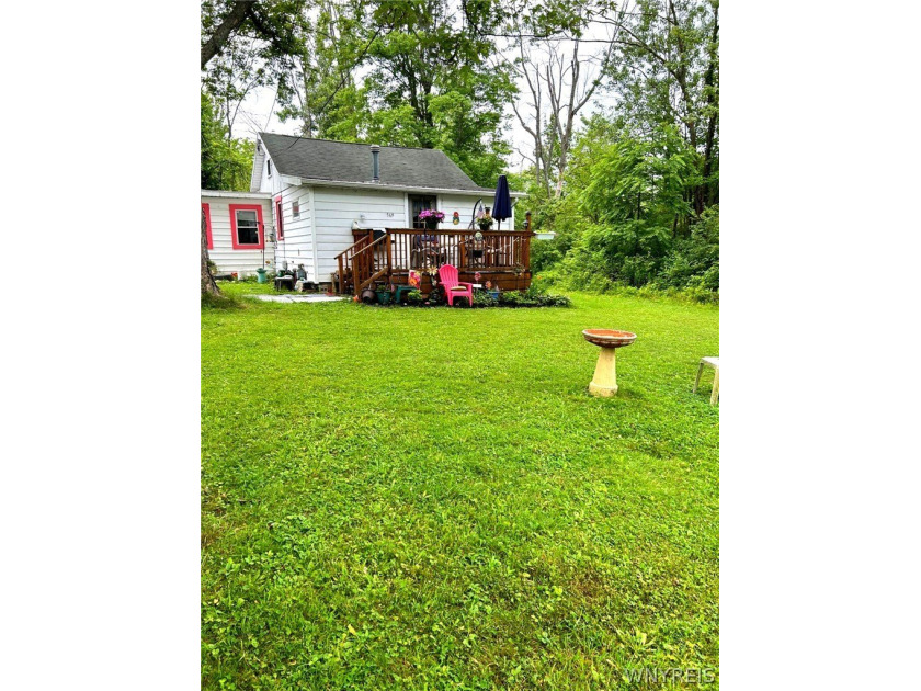 Cozy 1-bedroom, 1-bath home featuring an attached garage and a - Beach Home for sale in Angola, New York on Beachhouse.com