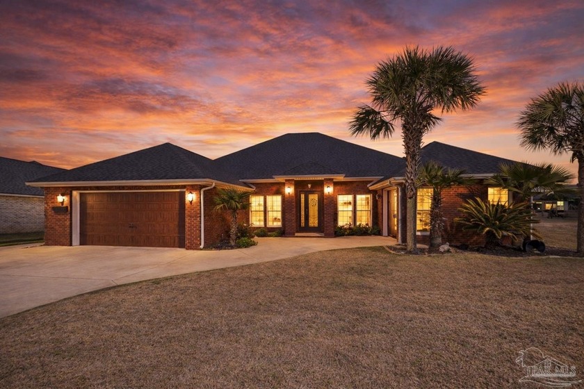 Welcome to this Custom-built lakefront residence offering - Beach Home for sale in Pace, Florida on Beachhouse.com