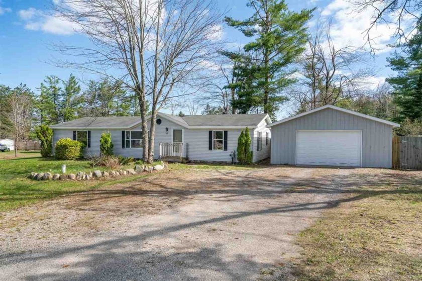 Affordable housing nestled on a large half-acre lot with a - Beach Home for sale in Alanson, Michigan on Beachhouse.com