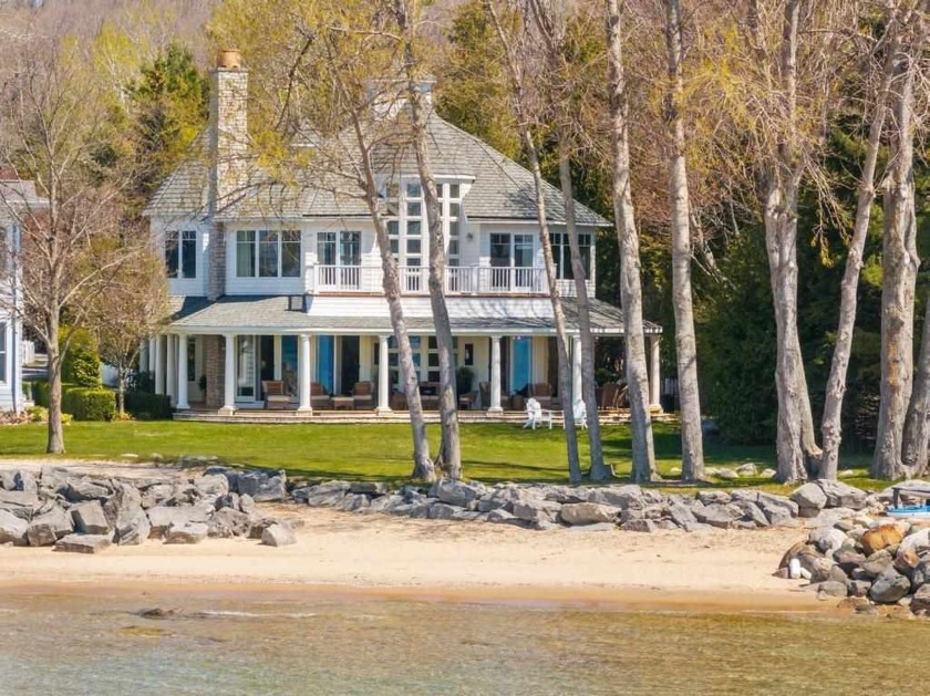 Experience refined waterfront living in this exquisite Harbor - Beach Home for sale in Harbor Springs, Michigan on Beachhouse.com