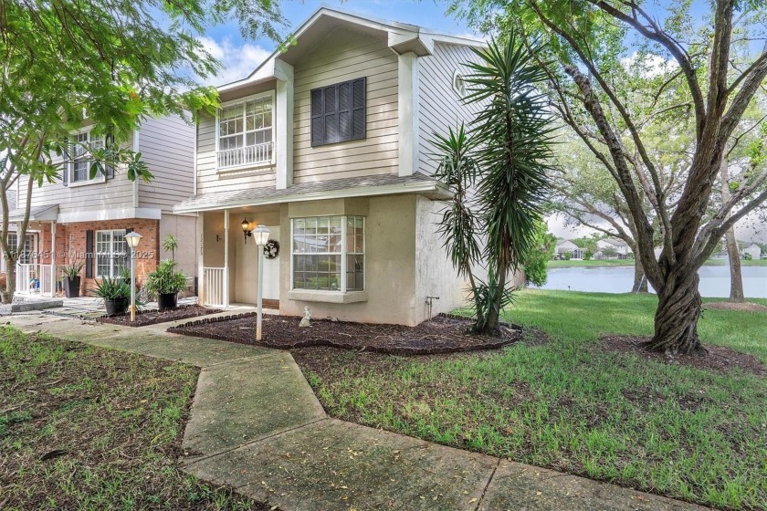 Experience tranquil lakefront living in this two-story villa at - Beach Townhome/Townhouse for sale in Sunrise, Florida on Beachhouse.com