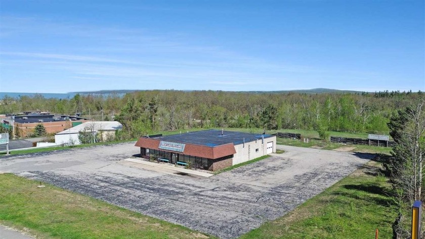 This expansive 3.6-acre parcel offers exceptional exposure with - Beach Commercial for sale in Petoskey, Michigan on Beachhouse.com
