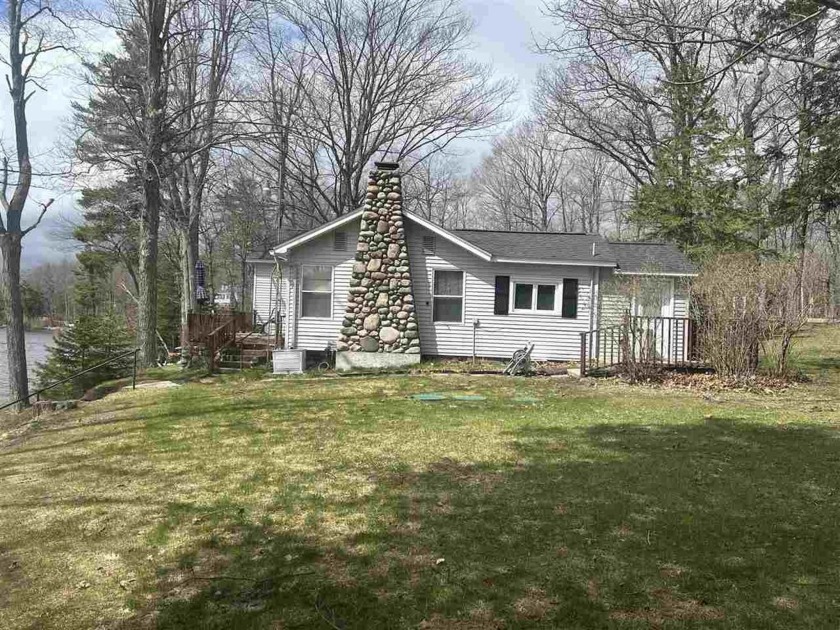 Lakefront living at it's best on Carp/Paradise Lake! Welcome to - Beach Home for sale in Carp Lake, Michigan on Beachhouse.com