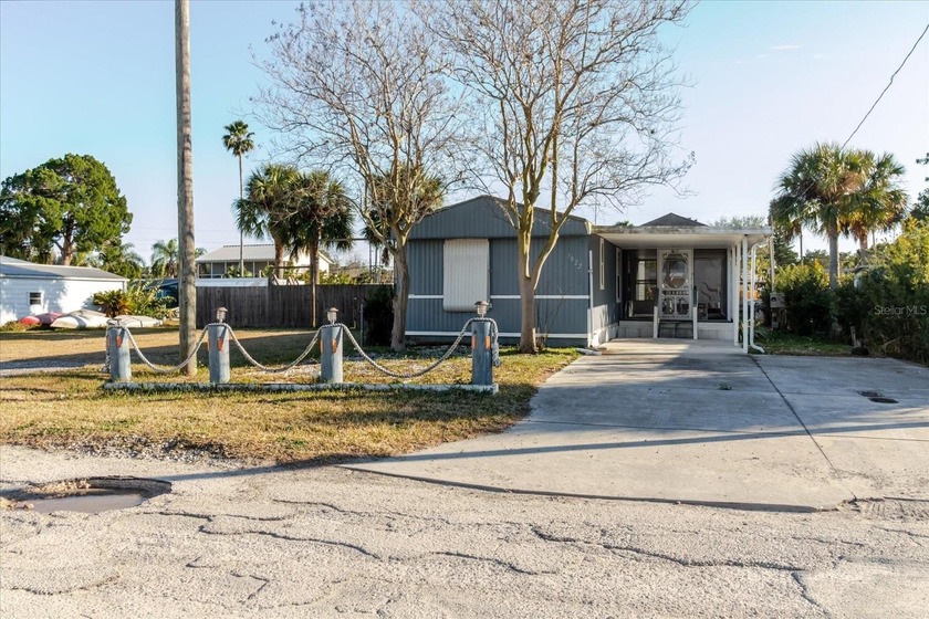 Charming waterfront mobile home offering exceptional potential - Beach Home for sale in Hudson, Florida on Beachhouse.com