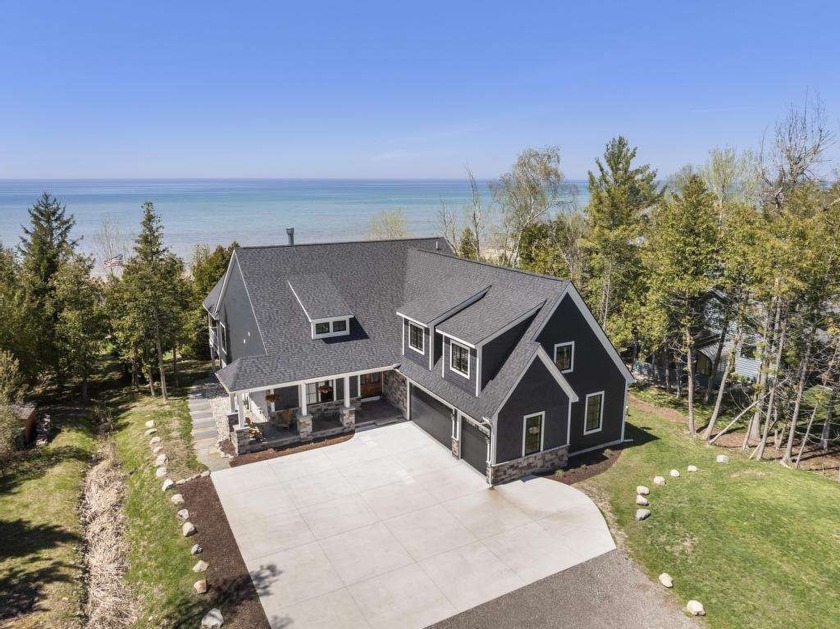 Custom built in 2020, this 5 bedroom Lake Michigan home with all - Beach Home for sale in Charlevoix, Michigan on Beachhouse.com