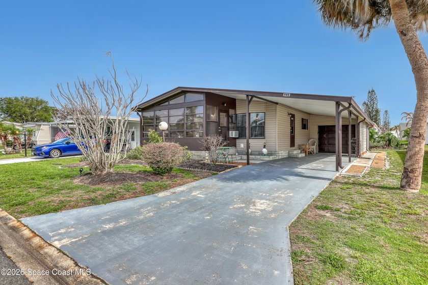 Located in the highly desirable community of Barefoot Bay, this - Beach Home for sale in Barefoot Bay, Florida on Beachhouse.com