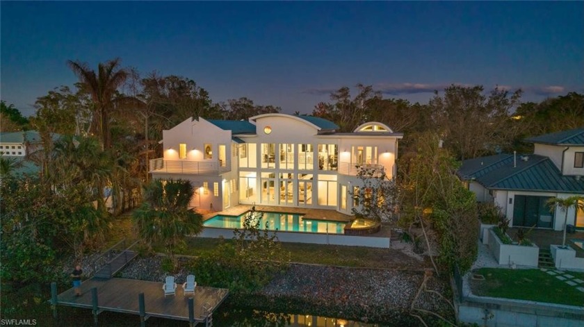 This gorgeous 2-story contemporary waterfront residence with - Beach Home for sale in Naples, Florida on Beachhouse.com