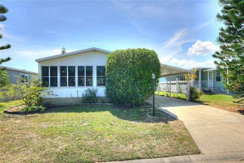 This beautifully maintained furnished home in the heart of - Beach Home for sale in Barefoot Bay, Florida on Beachhouse.com
