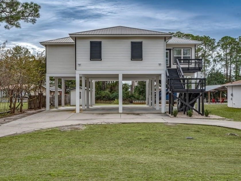 Beautiful 3 /2 Home on Canal. Features a Large Great Room - Beach Home for sale in Panacea, Florida on Beachhouse.com