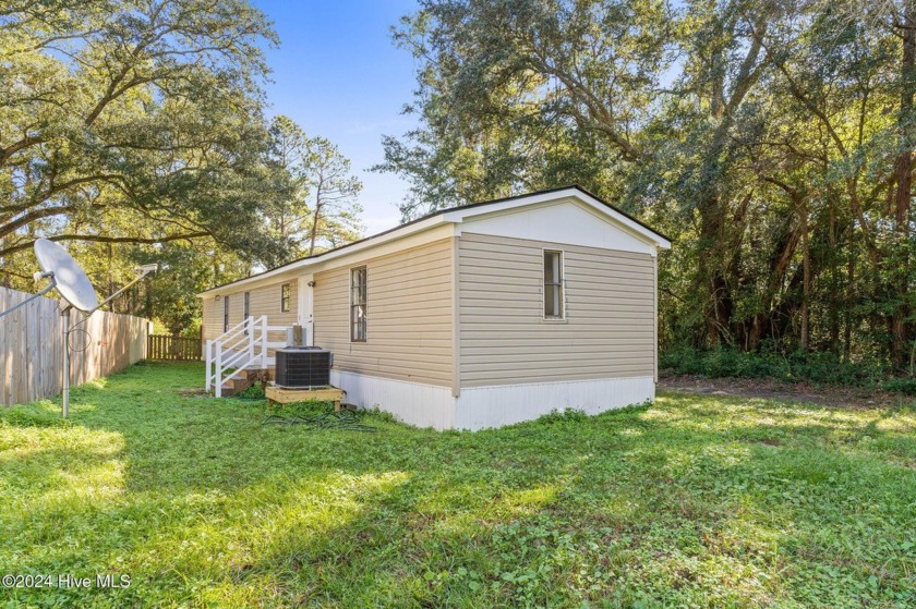 This 3 bedroom 2 bathroom home with a huge screened in porch has - Beach Home for sale in Shallotte, North Carolina on Beachhouse.com