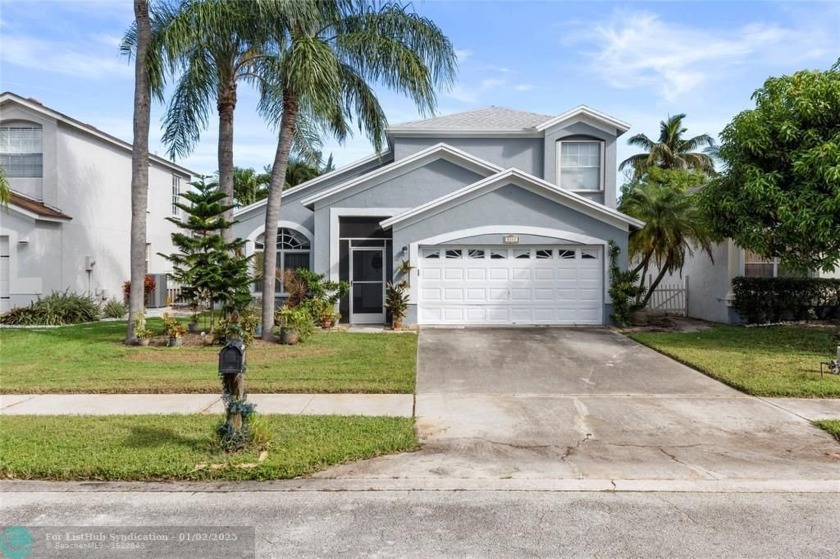 Lovely 4 bedroom, 2.5 bathroom home with a 2 car garage located - Beach Home for sale in West Palm Beach, Florida on Beachhouse.com