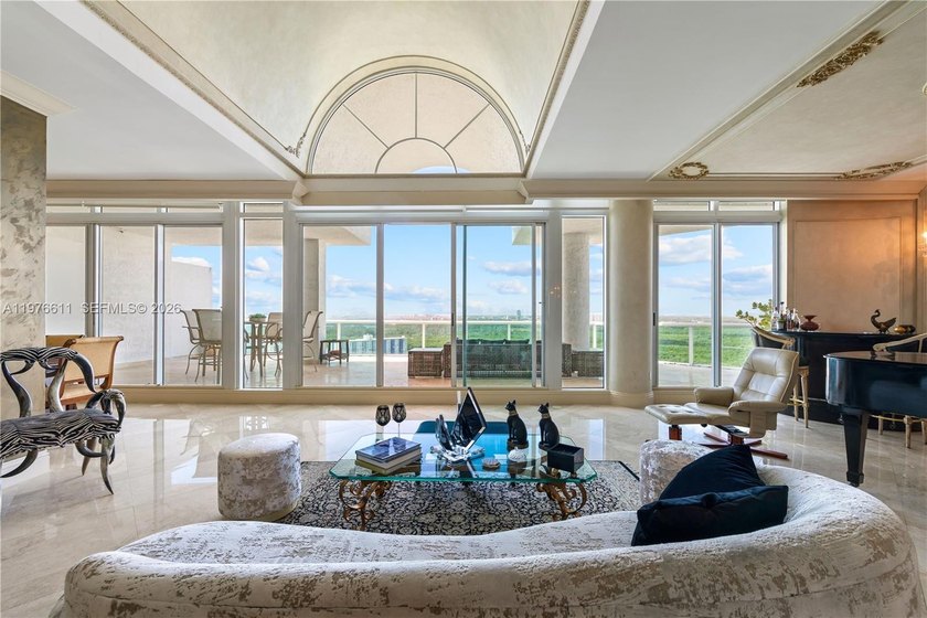 Perched high above it all, this spectacular two-level penthouse - Beach Condo for sale in Sunny Isles Beach, Florida on Beachhouse.com