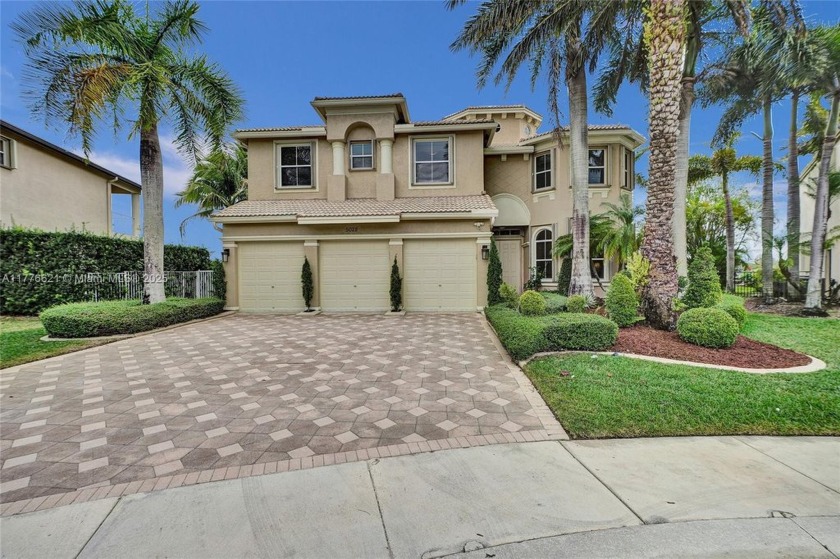 Tucked in a prestigious cul-de-sac on an expansive 11,171 sq ft - Beach Home for sale in Miramar, Florida on Beachhouse.com
