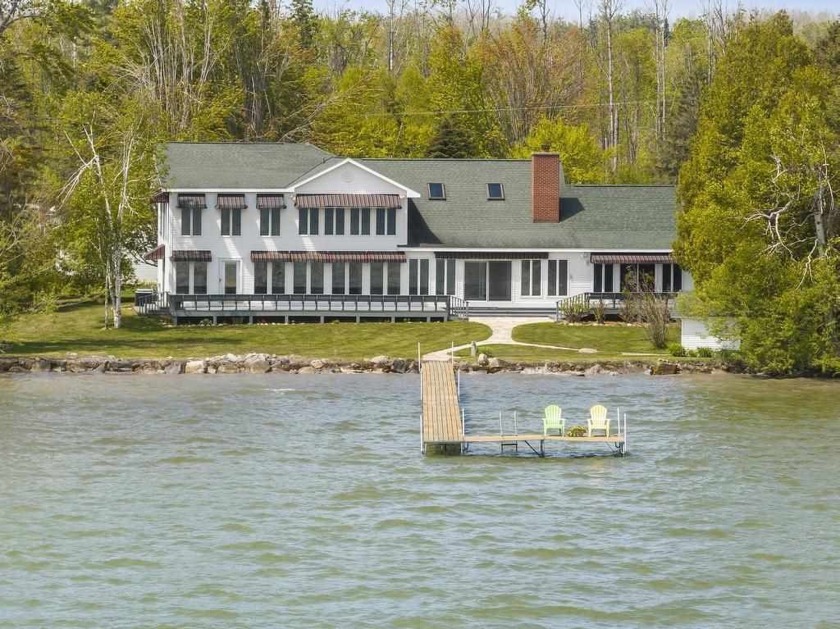 Welcome to a truly special generational home on the shores of - Beach Home for sale in Brutus, Michigan on Beachhouse.com