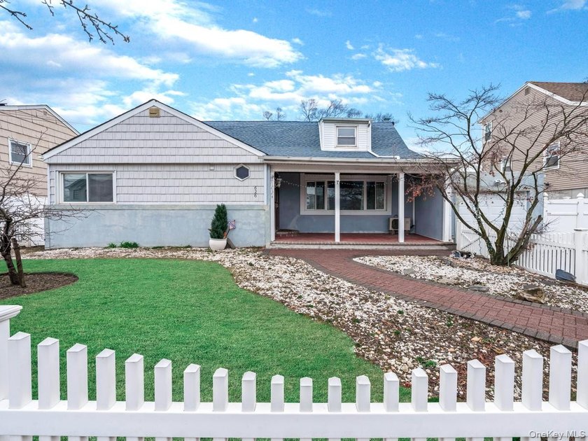 Welcome to this HUGE 5 bedroom 3 bath Cape offering abundant - Beach Home for sale in Oceanside, New York on Beachhouse.com