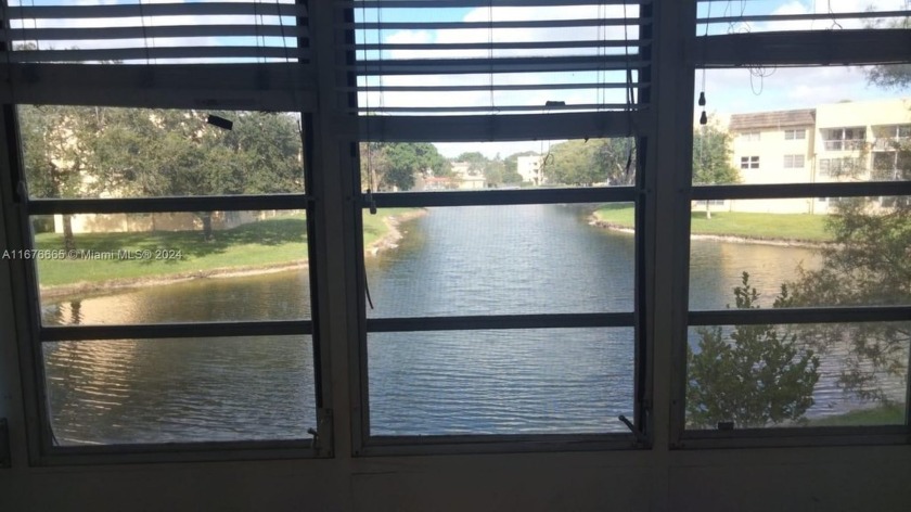 AS IS APARTMENT, LARGE ENCLOSED BALCONY FACING THE LAKE!! - Beach Condo for sale in Tamarac, Florida on Beachhouse.com