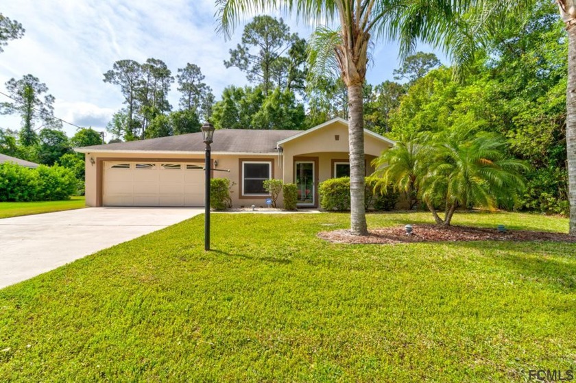 This beautiful 3 bedroom, 2 bath concrete block home features - Beach Home for sale in Palm Coast, Florida on Beachhouse.com