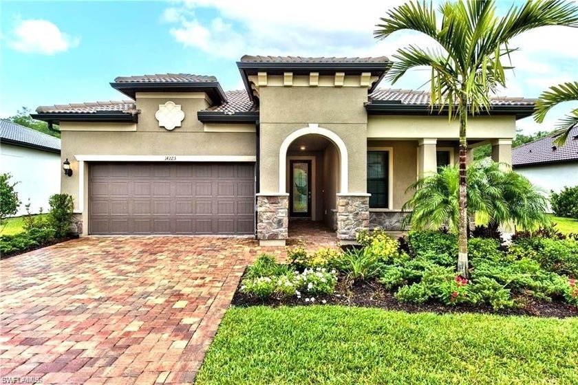 Located on a charming street within Corkscrew Shores, a - Beach Home for sale in Estero, Florida on Beachhouse.com