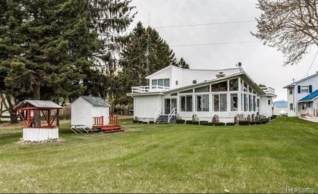 Immerse yourself in unparalleled lake living with this stunning - Beach Home for sale in Deckerville, Michigan on Beachhouse.com