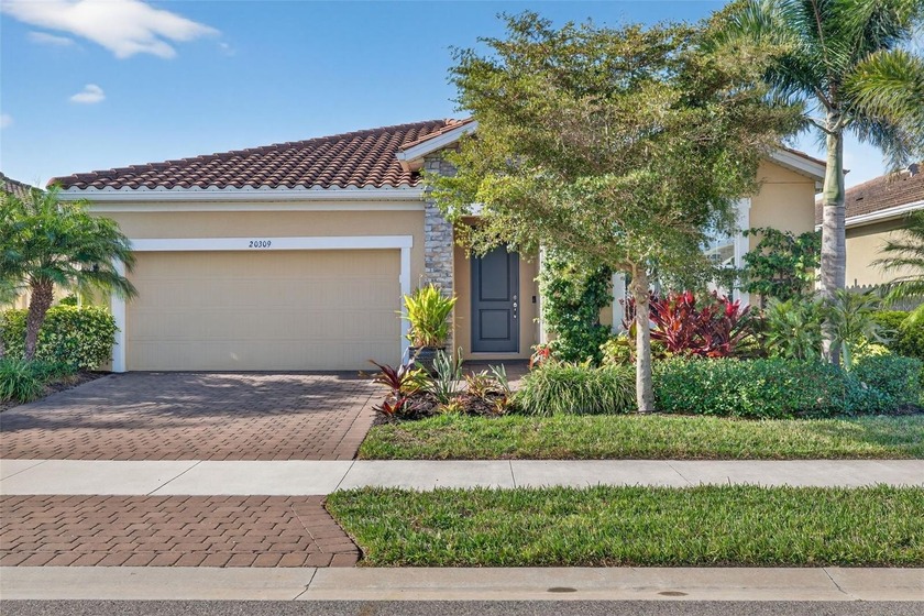 Welcome to this beautifully designed Tuscan-style three-bedroom - Beach Home for sale in Venice, Florida on Beachhouse.com