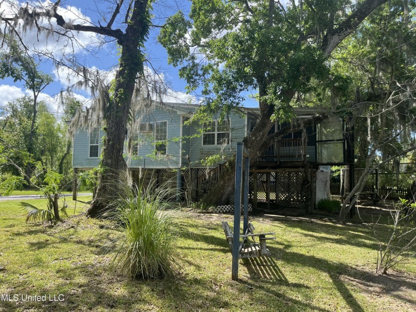 River front camp built on 2 lots in the desirable River Lodge Dr - Beach Home for sale in Moss Point, Mississippi on Beachhouse.com