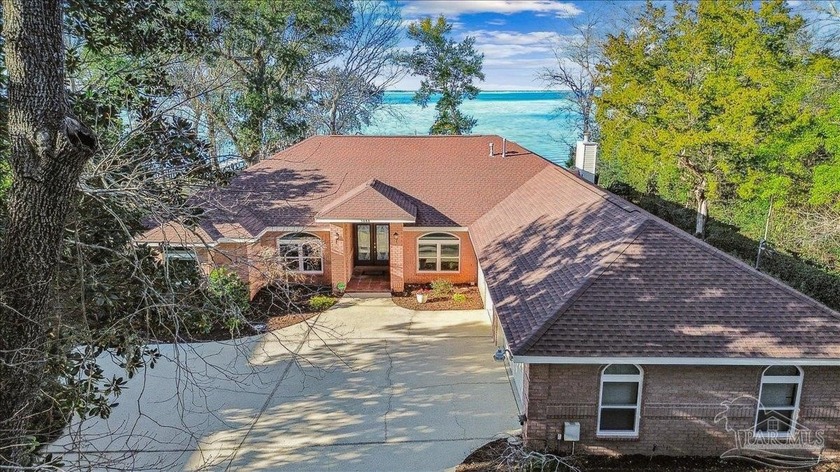 Impressive gated waterfront estate on 1.66 acres along East Bay - Beach Home for sale in Gulf Breeze, Florida on Beachhouse.com