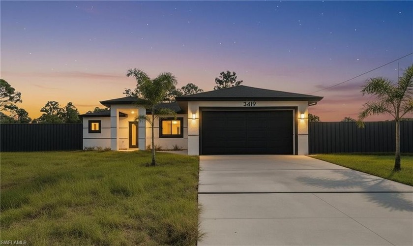 OVERSIZED LOT NEXT TO THE CANAL. This NEW CONSTRUCTION HOME - Beach Home for sale in Lehigh Acres, Florida on Beachhouse.com