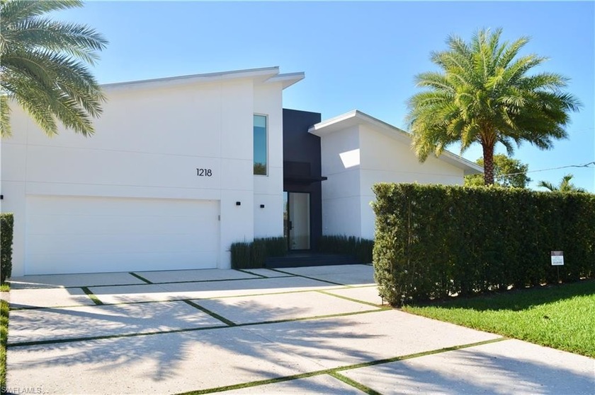 Modern comfort awaits in this meticulously maintained three or - Beach Home for sale in Naples, Florida on Beachhouse.com