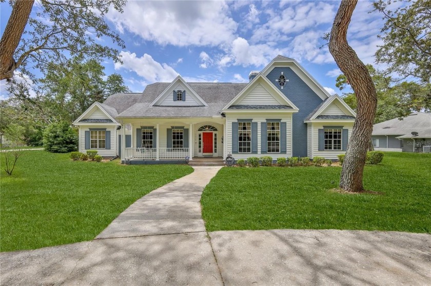 Elegant 3-Bedroom Pool Home on a Corner Lot in a Gated - Beach Home for sale in Spring Hill, Florida on Beachhouse.com