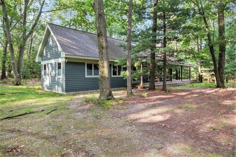 The Great Up North Escape! This low maintenance home is uniquely - Beach Home for sale in Mears, Michigan on Beachhouse.com