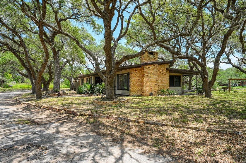 Nestled on 4.55 beautiful acres in Ingleside, this charming - Beach Home for sale in Ingleside, Texas on Beachhouse.com