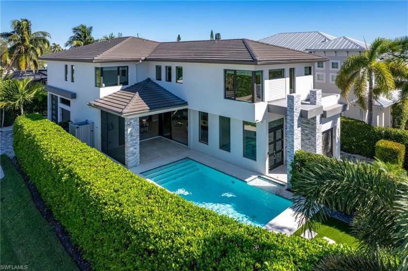 This Modern Beauty is just steps from the beach, located on the - Beach Home for sale in Naples, Florida on Beachhouse.com