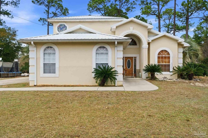 Welcome to this beautifully maintained Mediterranean-style home - Beach Home for sale in Pensacola, Florida on Beachhouse.com