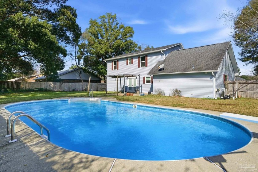This move-in-ready POOL HOME sits on a large lot in the - Beach Home for sale in Pensacola, Florida on Beachhouse.com